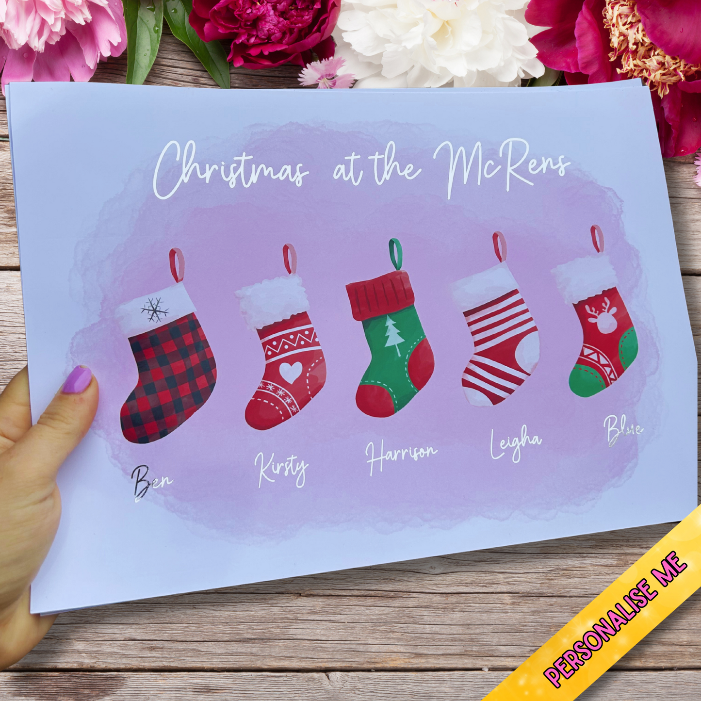 Festive handmade silver foil print featuring personalised stockings